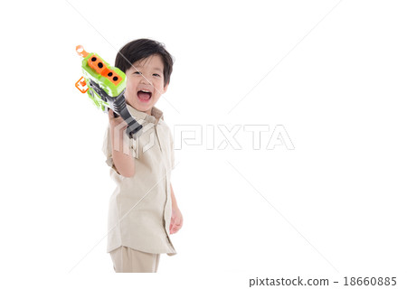Cute asian boy playing toy gun Cute asian boy playing toy gun 18660885