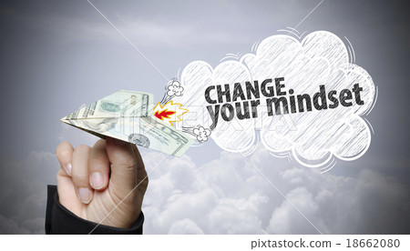 hand holding dollar plane with change your mindset 18662080