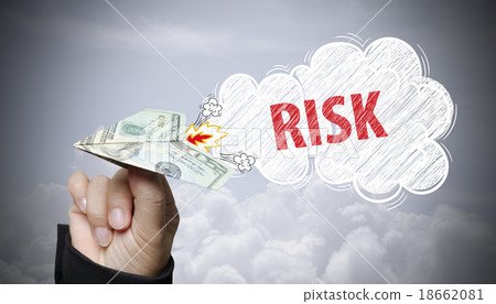 hand holding dollar plane with risk text hand holding dollar plane with risk text 18662081