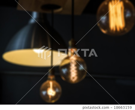 Blur of hanged lamps in dark room 18663159