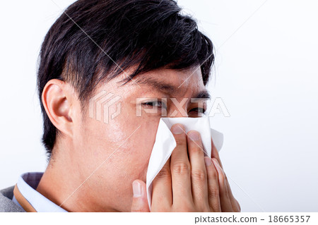 Male blowing nose 18665357