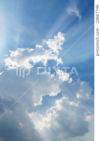 clouds in blue sky with sunrays 18667740