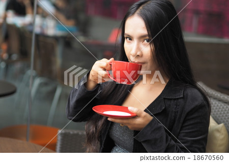 Asian woman with cup of coffee 18670560