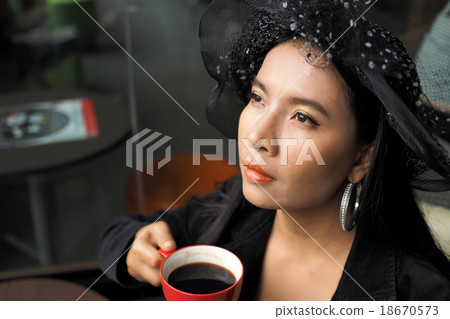 Asian woman with cup of coffee 18670573