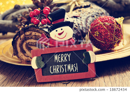 yule log and chalkboard with text merry christmas 18672434