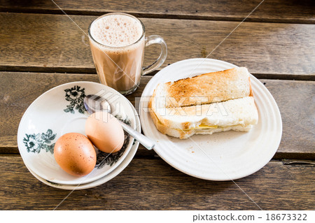 Popular Malaysian breakfast tea, eggs, toast bread 18673322