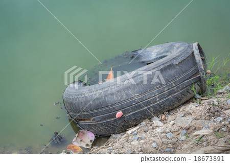 The old tires near the river 18673891