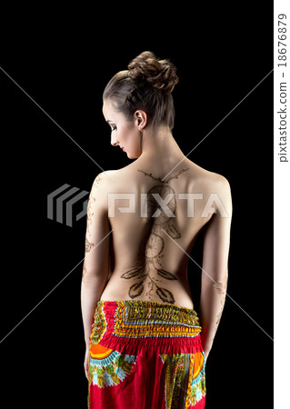 Mehendi. Shot of woman's back painted with henna 18676879