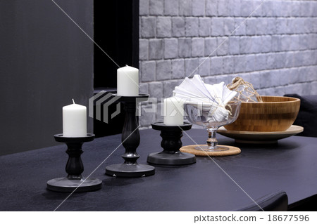 White Candles with candlestick on wooden table White Candles with candlestick on wooden table 18677596