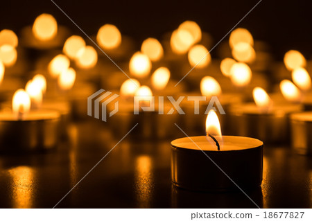 Candles light. Christmas candles burning at night. 18677827