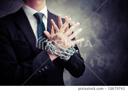 A businessman wrapped in a chain 18679742