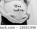 pregnant woman holding her belly  18681996