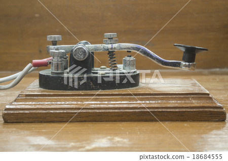 old morse key telegraph on wood table old morse key telegraph on wood table 18684555