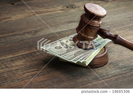 Judges Gavel And Bundle Of Money On The Table 18685306