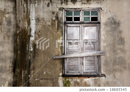 old window in an ancient brick wall old window in an ancient brick wall 18685545