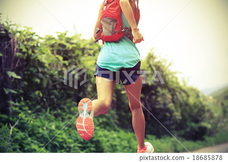 trail runner athlete running on forest trail.   trail runner athlete running on forest trail.   18685878
