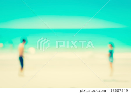 Blur image of two people playing at the beach Blur image of two people playing at the beach 18687349