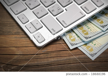 Computer Keyboard  And Cash On The Wood Background 18688196