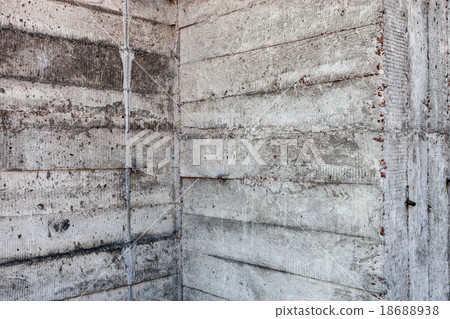 Grey concrete wall with hardened traces  18688938