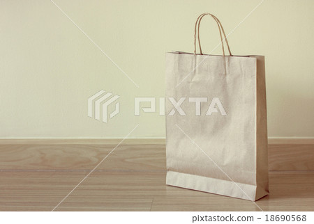 brown paper bag on the floor 18690568