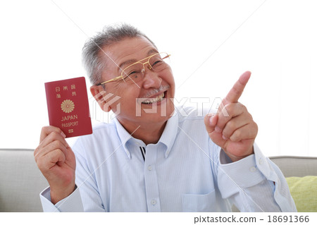 Senior men with a passport with a smile 18691366