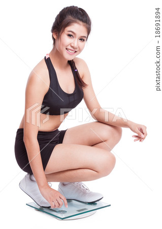 Happy woman with scales on white background Happy woman with scales on white background 18691894