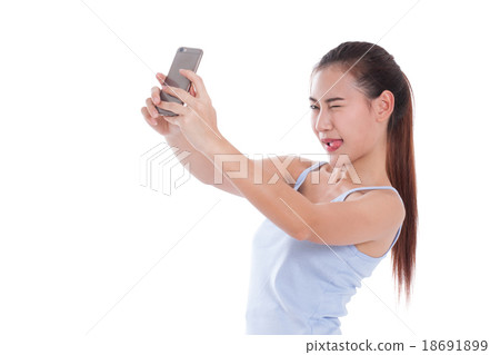 woman taking a selfie using her smartphone woman taking a selfie using her smartphone 18691899