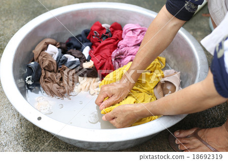 Hands wash stain of dirty clothes 18692319
