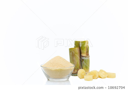 Brown Sugar in bowl and stump of sugar cane Brown Sugar in bowl and stump of sugar cane 18692704