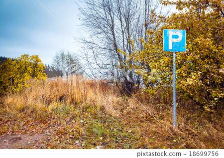 Empty parking lot with roadsign in countryside 18699756