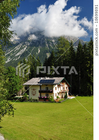 House in Front of Dachstein Mountain, Styria, Austria House in Front of Dachstein Mountain, Styria, Austria 18699891