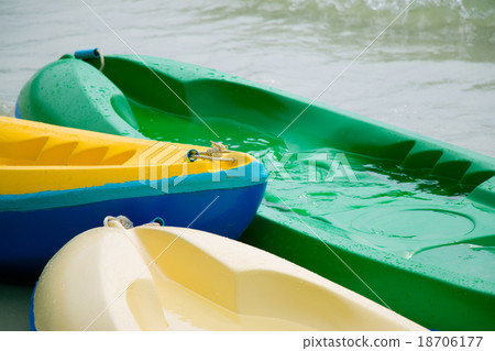 Canoe, kayaks land on the beach 18706177
