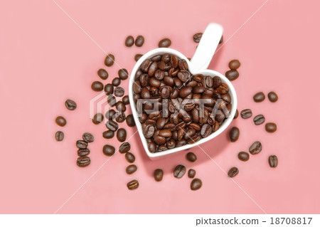 Roasted Coffee beans in heart shape cup. 18708817