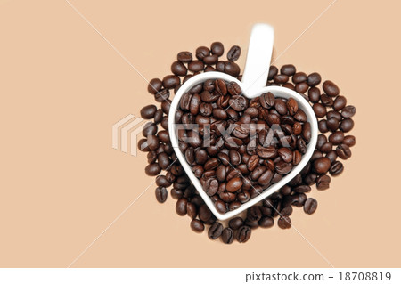 Brown Coffee beans in heart shape cup. Brown Coffee beans in heart shape cup. 18708819