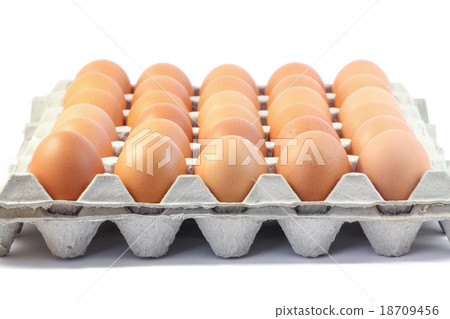 Fresh eggs in paper tray on white background 18709456