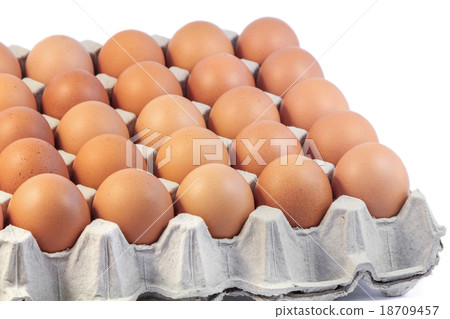 Fresh eggs in paper tray on white background 18709457