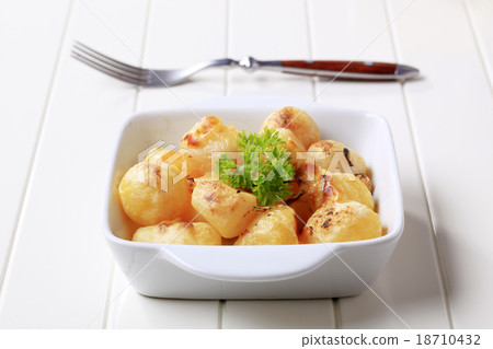 Cheese coated potatoes 18710432