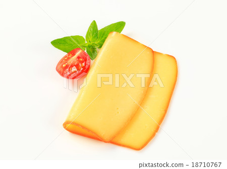 Slice of smoked cheese Slice of smoked cheese 18710767