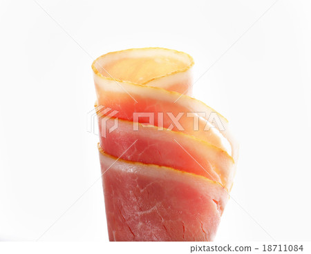 Thin slices of cooked ham, rolled up 18711084
