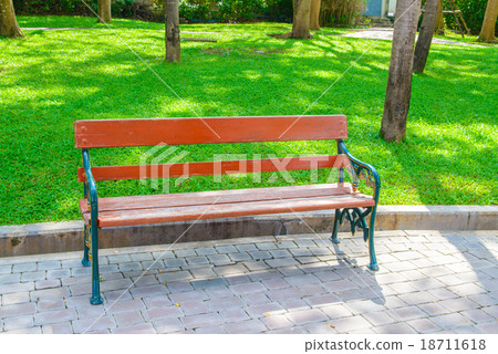 Green and brown wooden park bench Green and brown wooden park bench 18711618