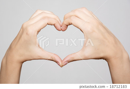 Female hands making shape heart Female hands making shape heart 18712183