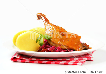 Roast duck with potato dumplings and red cabbage Roast duck with potato dumplings and red cabbage 18712305