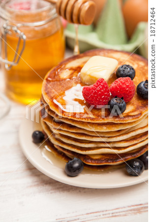 High pile of delicious pancakes High pile of delicious pancakes 18712464