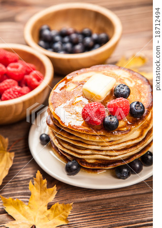 High pile of delicious pancakes High pile of delicious pancakes 18712494