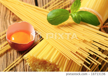 Dried spaghetti and raw egg 18713136