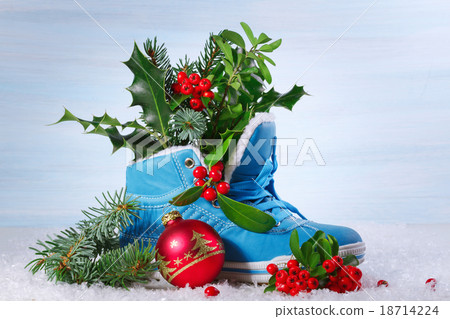 Blue shoe with Holly leaves and berries. Christmas background 18714224