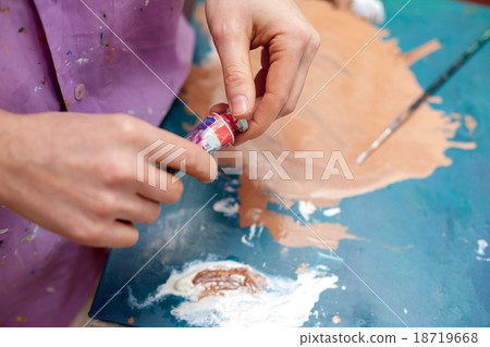 Artist's hands close-up on the background of Artist's hands close-up on the background of 18719668