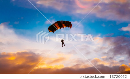 Skydiver On Colorful Parachute In Sunny Sunset 18720052