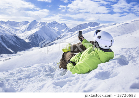 Young men with smartphone mountain winter resort 18720688