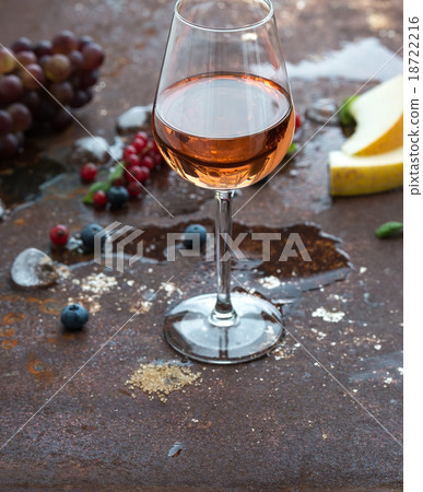 Glass of rose wine with berries, melon, grapes and Glass of rose wine with berries, melon, grapes and 18722216